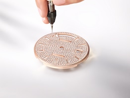 Hand-setting an 18 ct Everose gold dial with diamonds