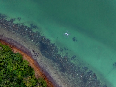 The Marine Conservation Cambodia team use a drone to survey the waters of the Kep Archipelago from above, which helps them to locate and monitor seagrass meadows.