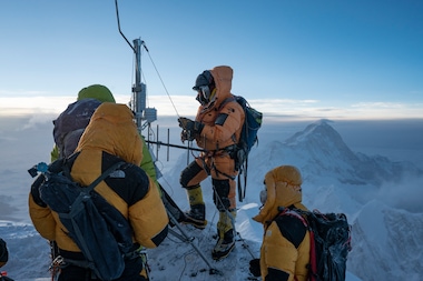 THE HIGH-ALTITUDE EXPEDITION TEAM ASSEMBLES THE WORLD'S HIGHEST AUTOMATED WEATHER STATION AT THE BALCONY ON THE SOUTHEAST RIDGE OF MT. EVEREST.