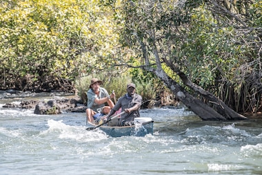South African conservationist Steve Boyes and local guide Abraão Tony Luhoke attempting to canoe through the Cassai River rapids. The River is Africa’s second largest river by volume and can be a very dangerous place to explore.