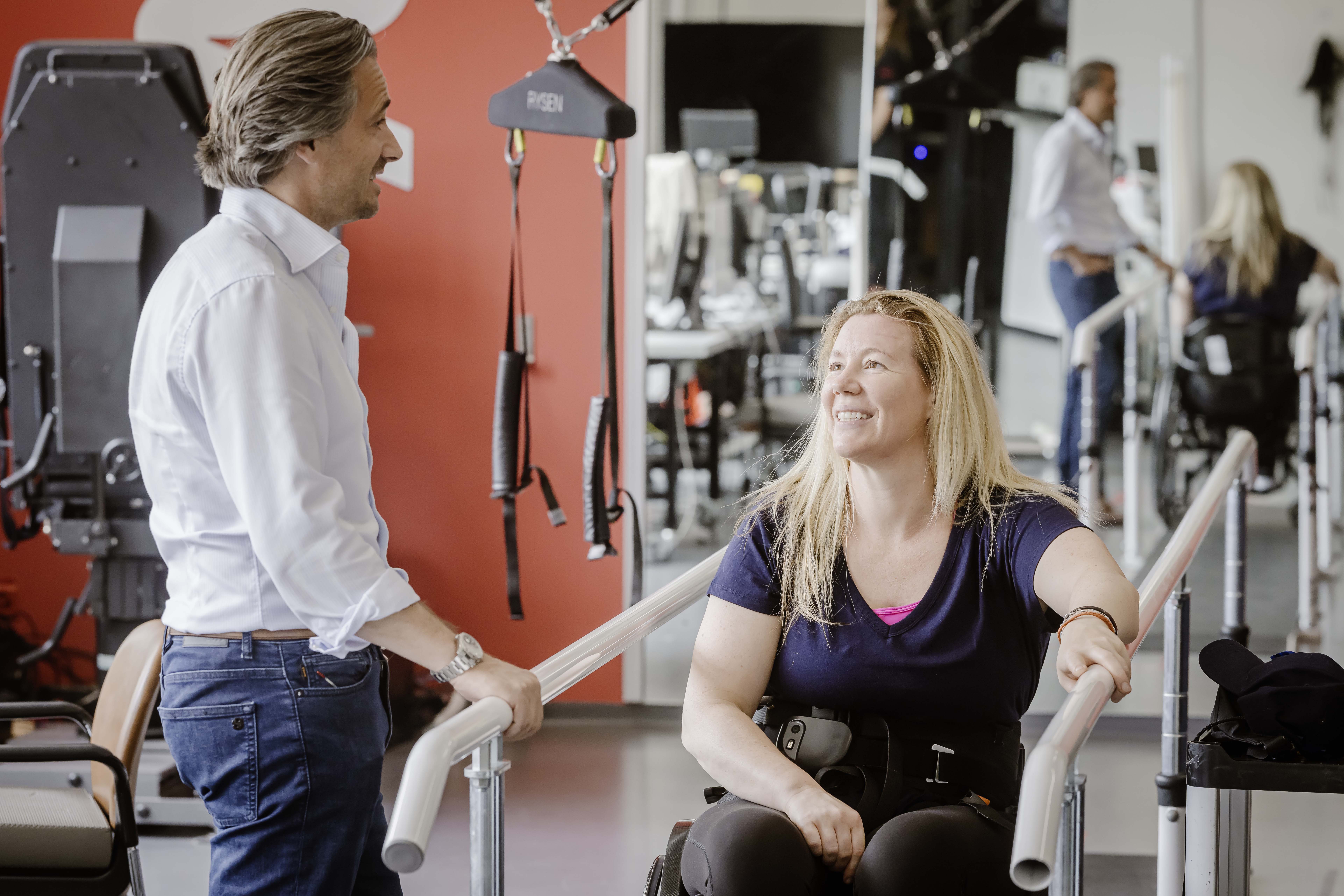 Neuroscientist Grégoire Courtine chatting to patient Suzanne Edwards during a physiotherapy session. “What Grégoire has done and continues to do, is incredible,” says Edwards. “The team that he has built up is incredibly intelligent and driven. Everyone really wants this to work.”