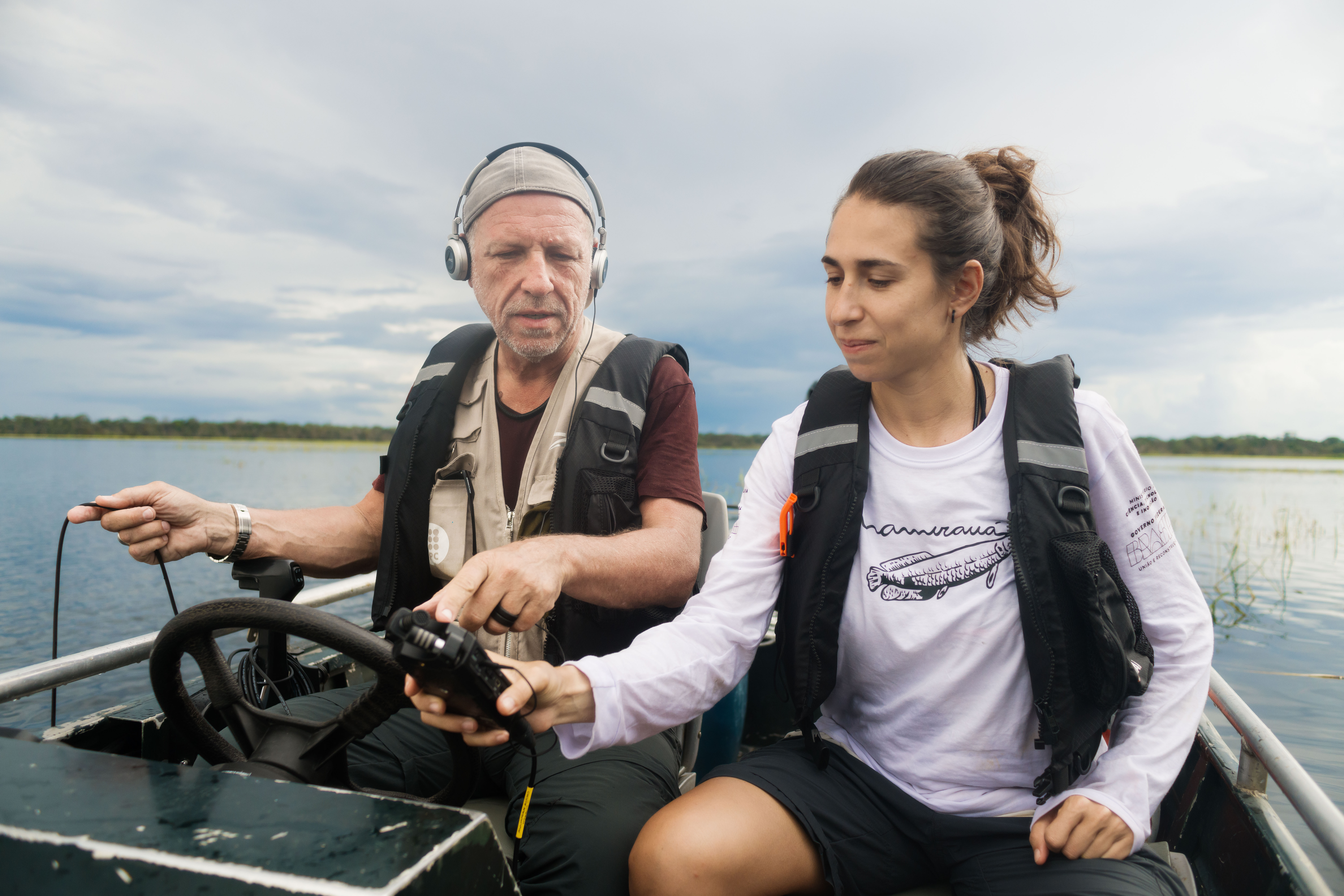 Bioacoustician and Rolex Awards Laureate Michel André and team member Marina Calderon listening to the sounds being recorded by a hydrophone in the Amanã Reserve.
