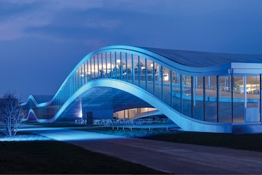 AN EXTERIOR VIEW OF THE EPFL ROLEX LEARNING CENTER IN LAUSANNE DESIGNED BY SANAA.