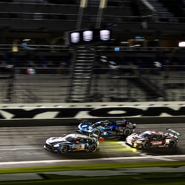 ACTION ON THE BANKING AT NIGHT DURING THE RACE