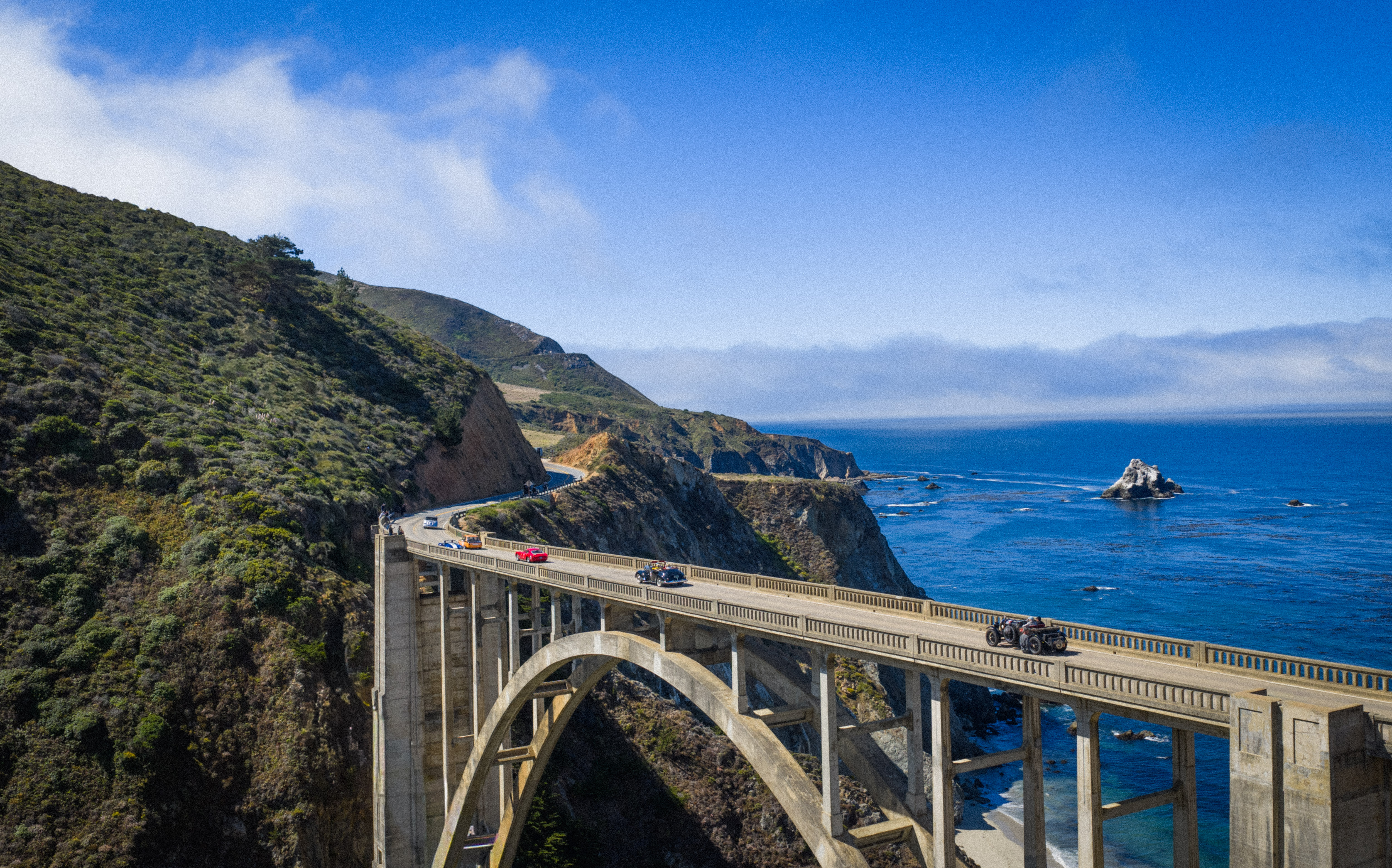 CLASSIC CARS ON BIXBY BRIDGE DURING THE 2025 PEBBLE BEACH TOUR D'ELEGANCE® PRESENTED BY ROLEX