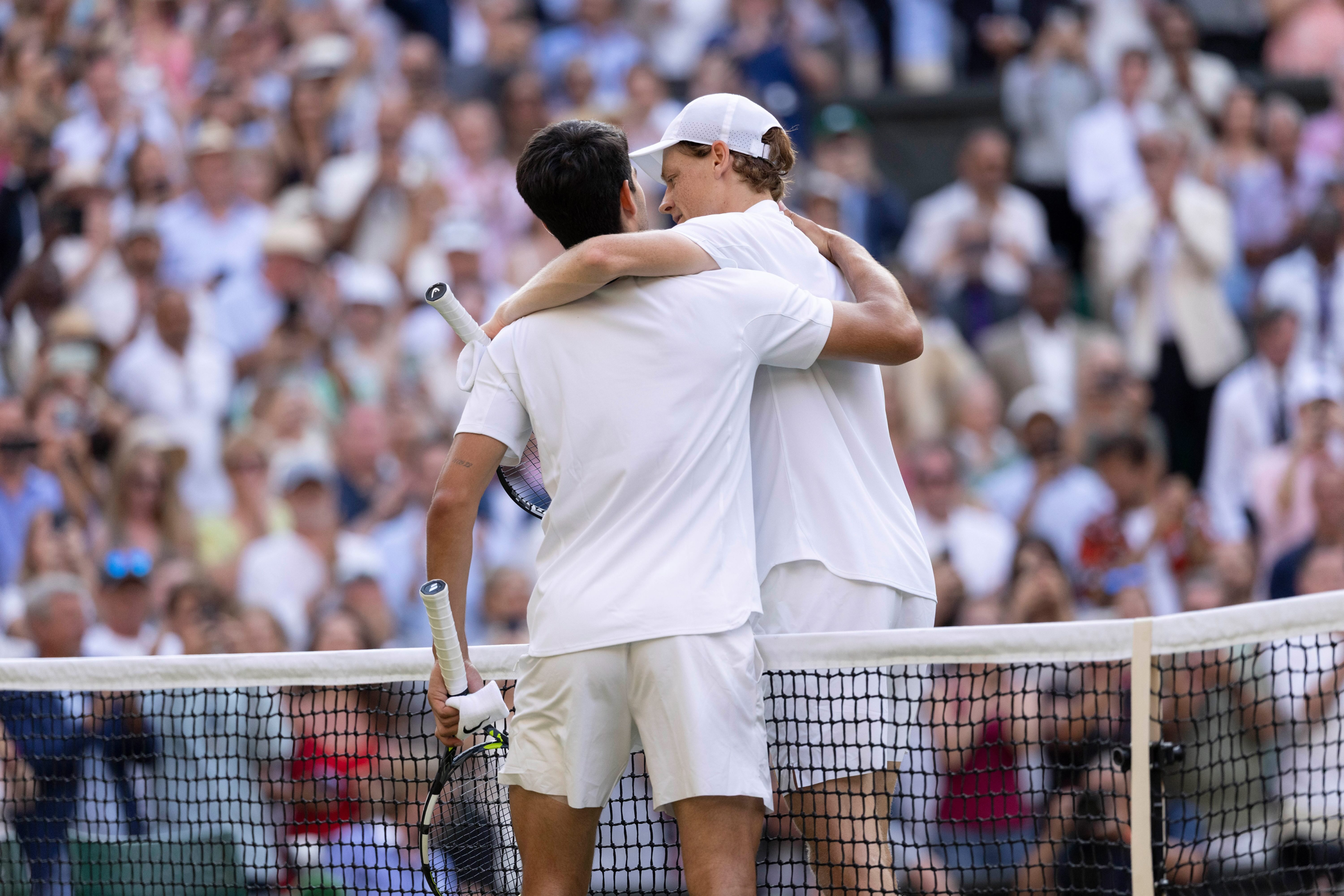 ROLEX TESTIMONEES JANNIK SINNER AND CARLOS ALCARAZ EMBRACE AFTER THE GENTLEMEN'S SINGLES FINAL AT THE CHAMPIONSHIPS, WIMBLEDON 2025